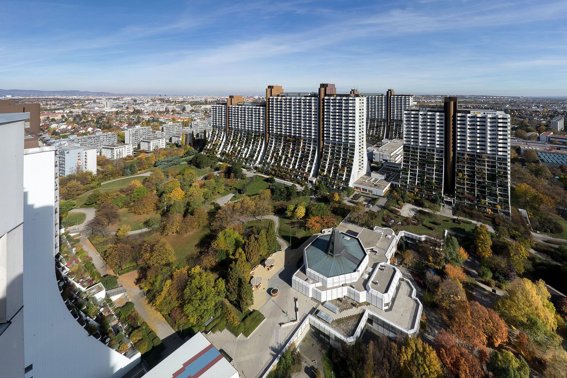 View from a roof onto other building of the Alterlaa residential development. Large park between the buildings