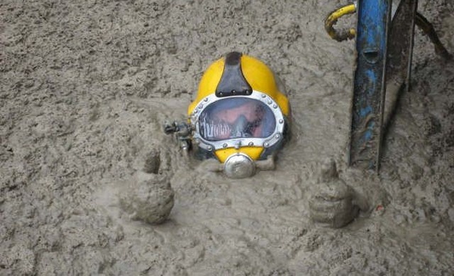 a diver in a pool of shit