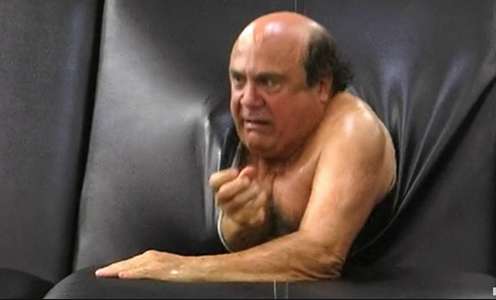 Image of Danny DeVito climbing out of a couch