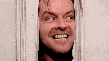 Jack Nicholson in The Shining making threats maniacally through a partially closed & blocked door.