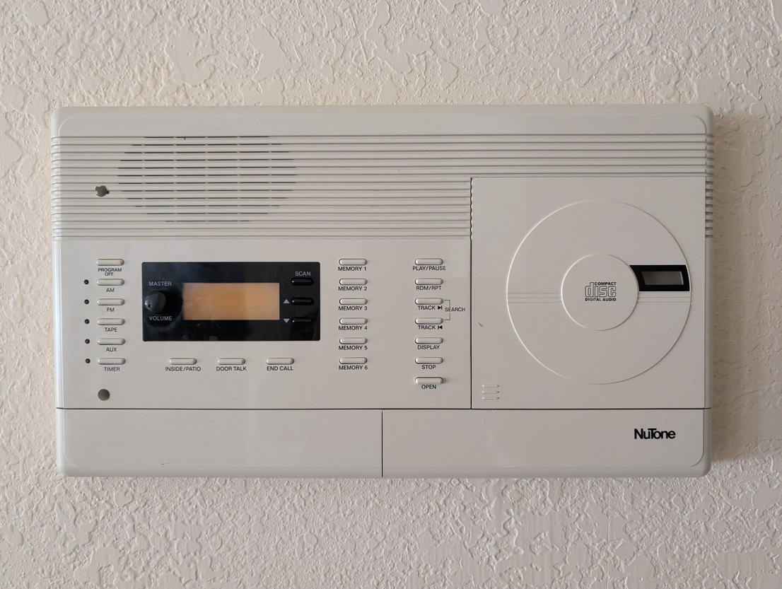 Photo of a NuTone Intercom with a built-in CD player and FM tuner