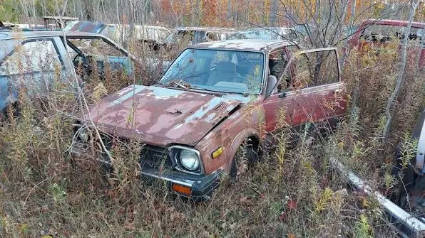 Honda Civic abandoned in a field.